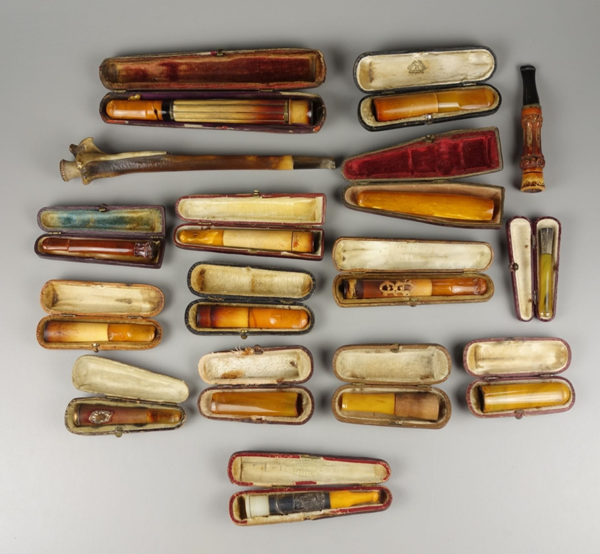 16 cigar and cigarette holders, partly amber, c. 1890-1920