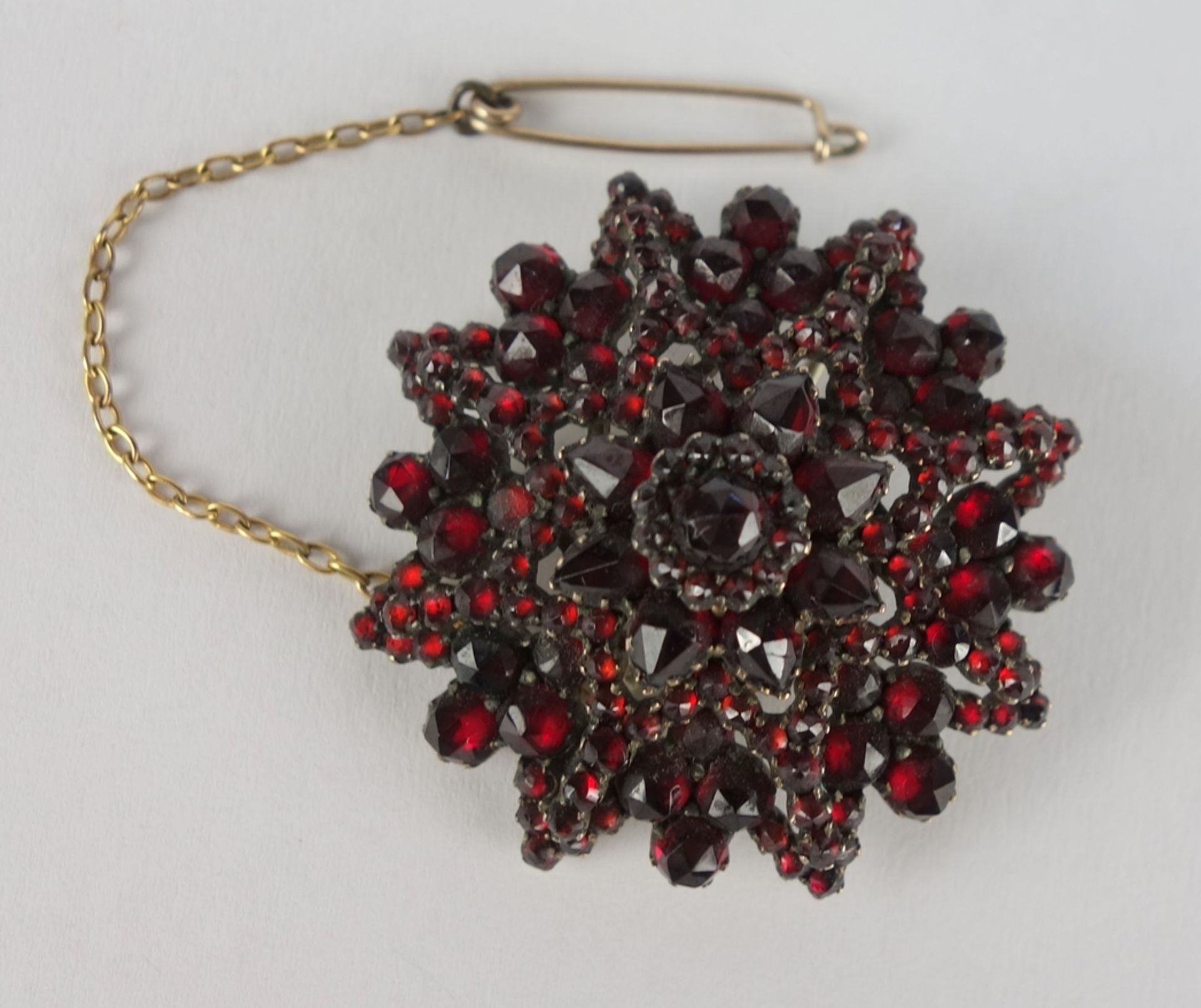 round garnet brooch, tombac, Bohemia c.1890