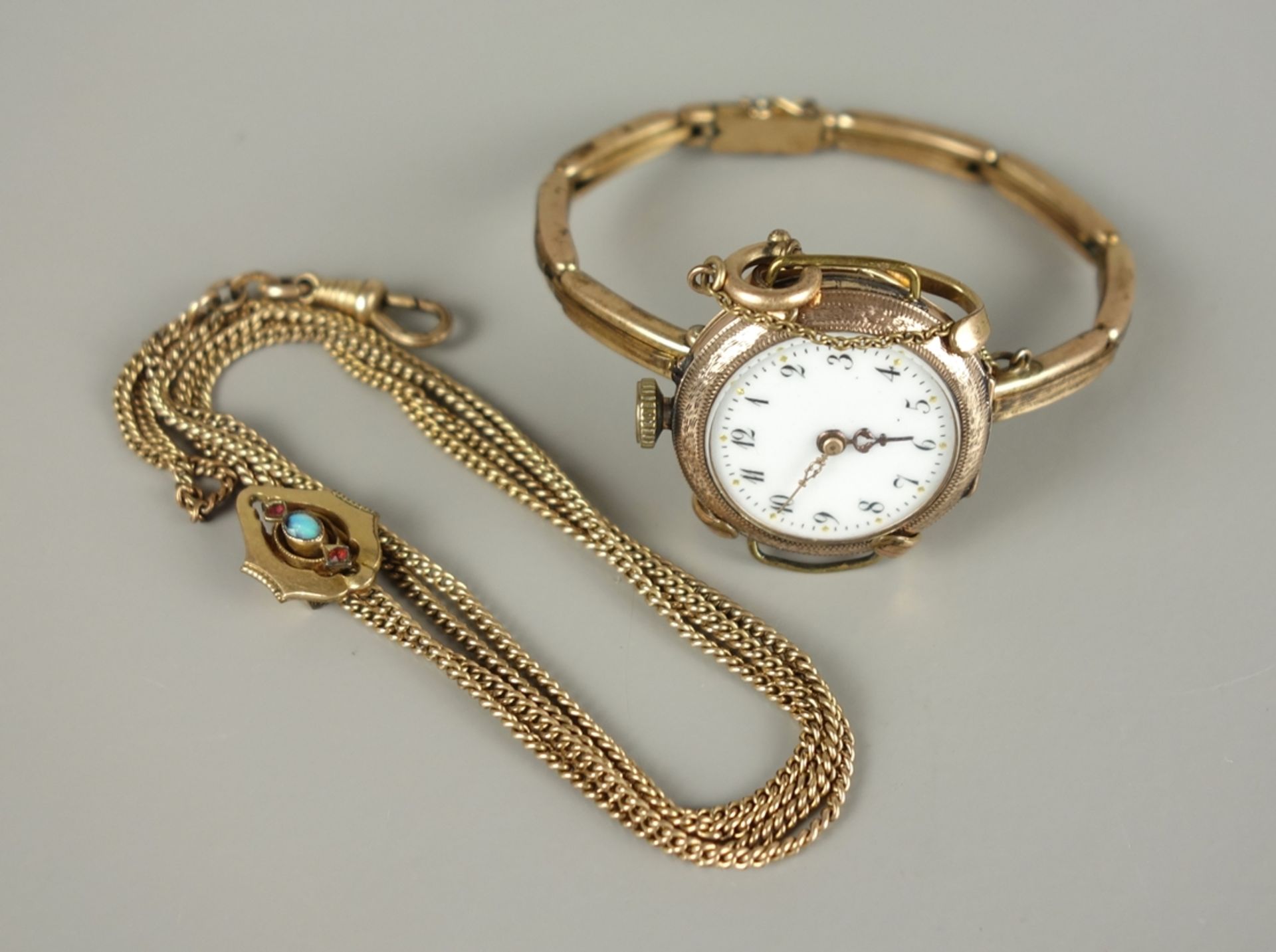 Damenuhr mit Federzugarmband und Uhrenkette mit Schieber, um 1900/1910