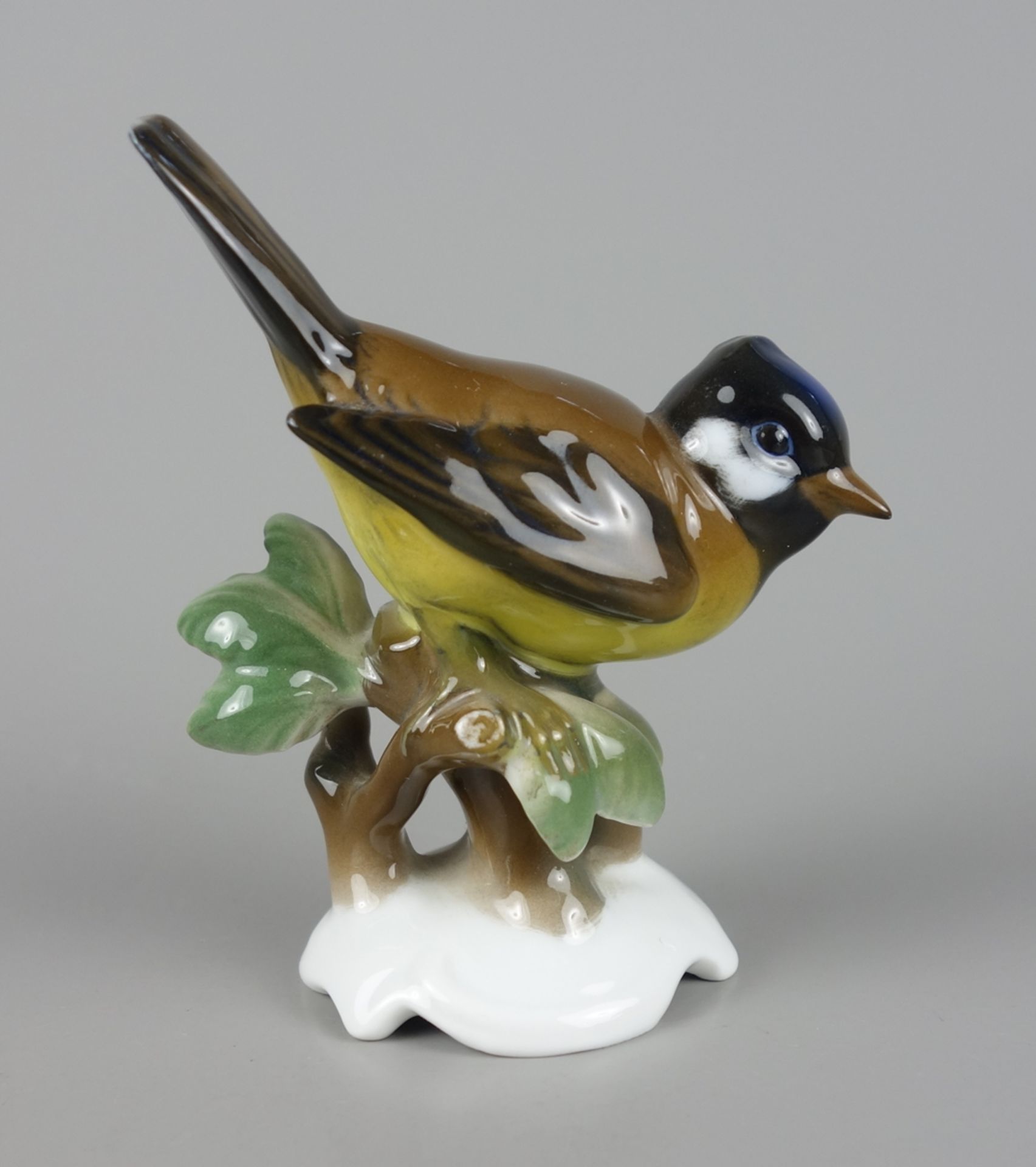 Blue tit on branch with leaves, Hugo Meisel for Rosenthal, 1930s / 1940s
