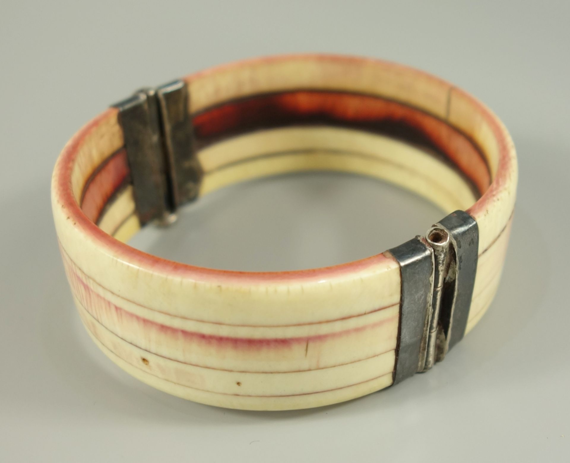 Bangle of bone with silver mounting