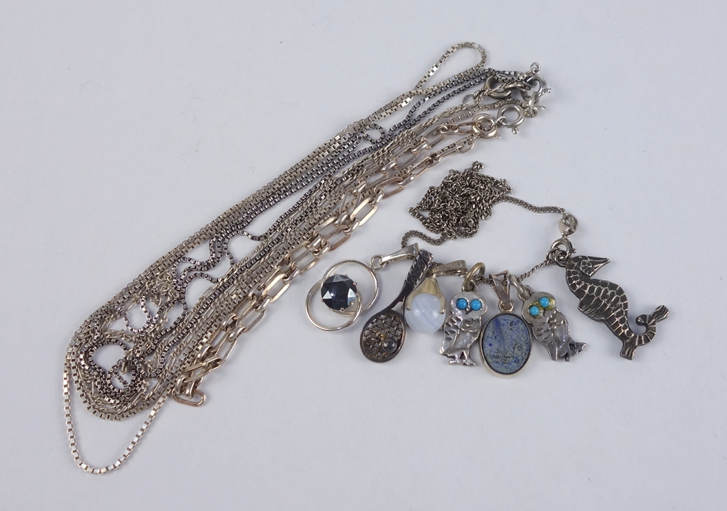 7 small pendants, 1 bracelet and 4 chains, silver