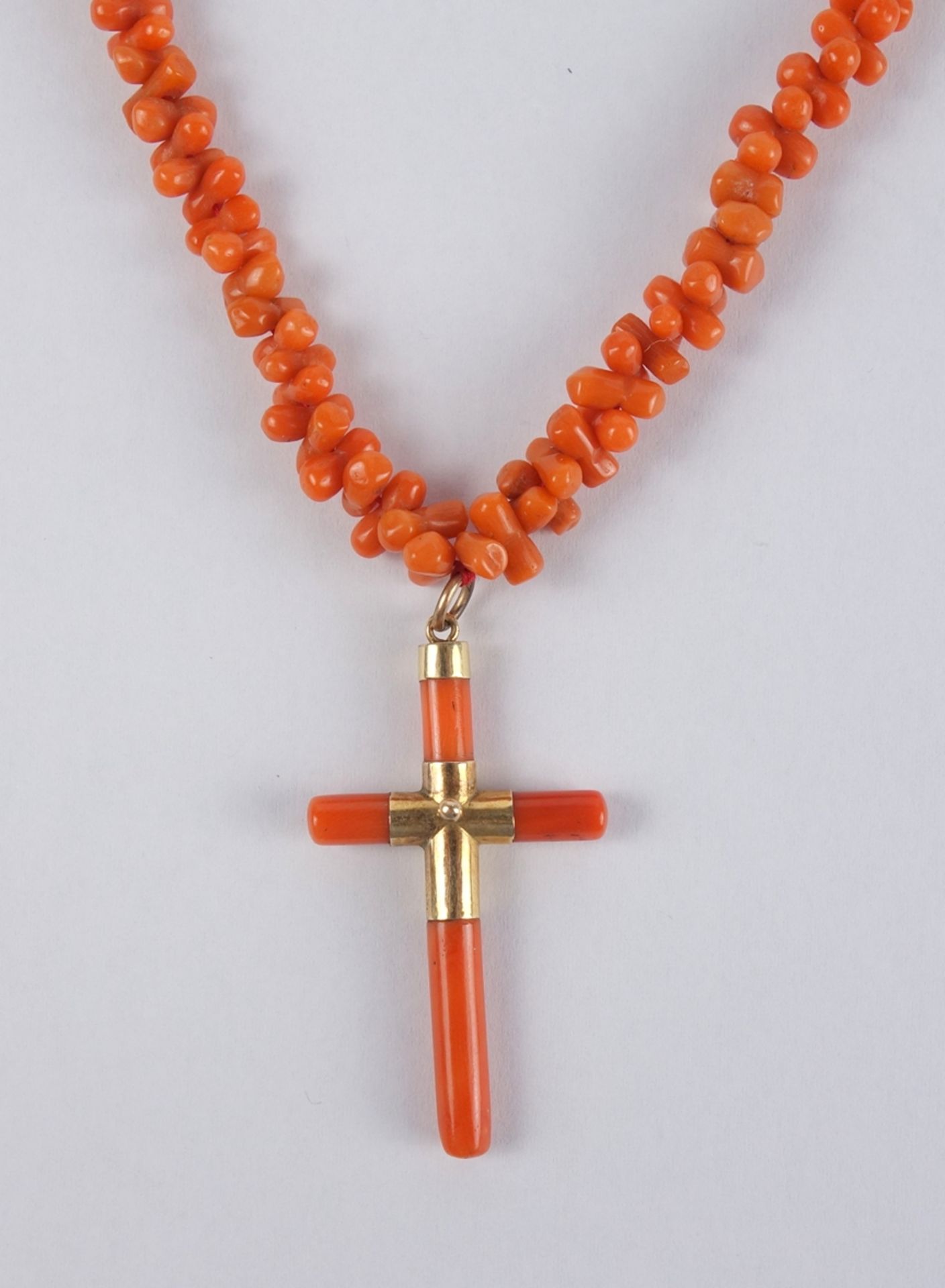 Coral necklace with coral cross pendant, around 1920