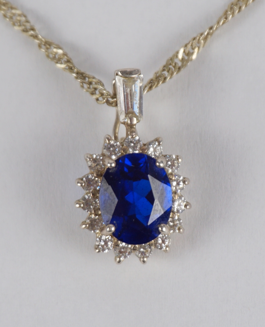 Clip pendant with bright blue stone and zirconia on chain, 925 silver, total wt.5.79g