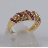 Ring mit 15 Rubinen und 18 Brillanten, total ca.0,20ct, Gew.3,73g