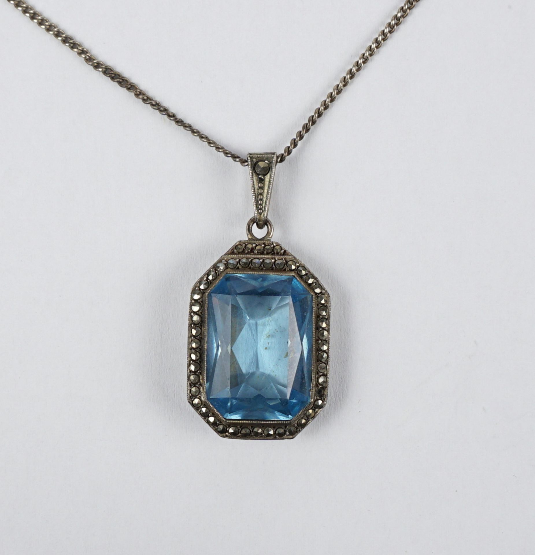 Pendant with aquamarine coloured stone and marcasites on chain, 835 silver, wt.9,96g