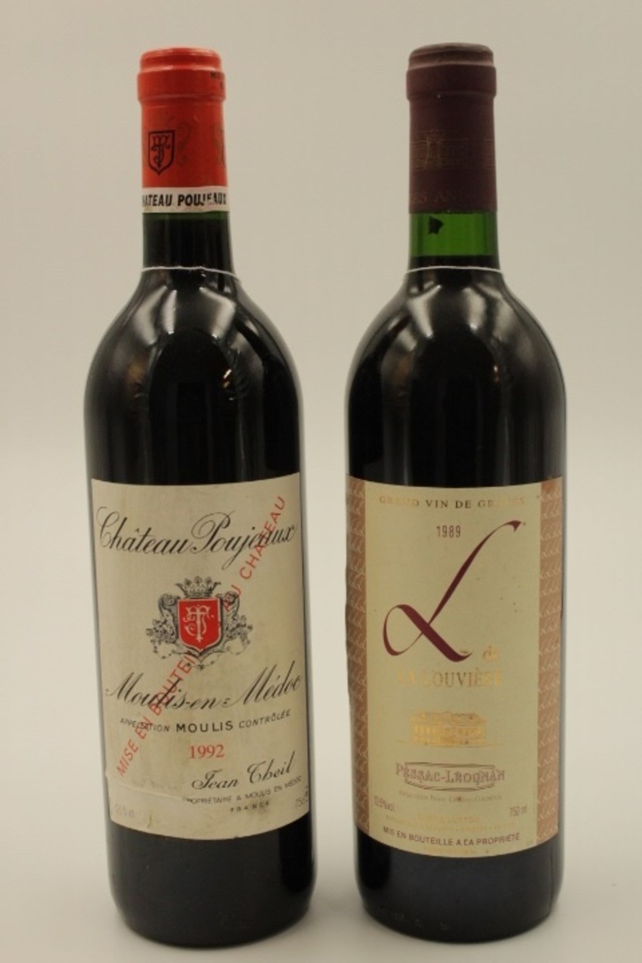 2 Flaschen Rotwein Frankreich 1xDe LA LOUVIERE PESSAC-LEOGNANG 1989 750ml. 12,5%vol. 1xChateau