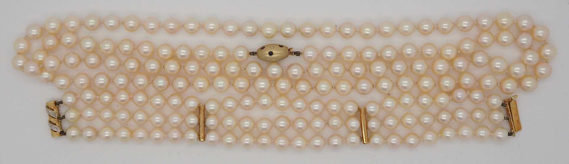 1 Perlenkette Verschluss GG 14ct. Rubine Saphire Brill. sowie 1 dreireihiges Perlarmba
