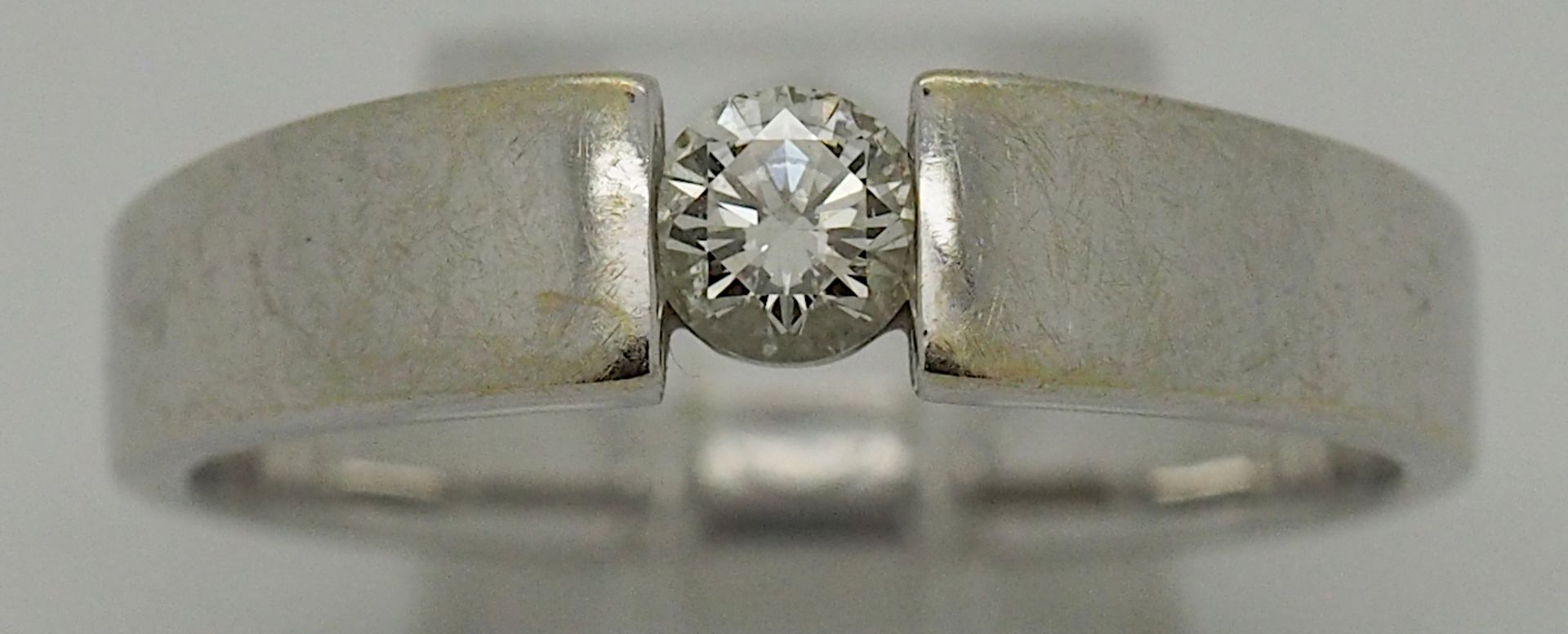 1 Damenring WG 14ct. lt. Schmuckkarte Brill ca. 0,25ct. getöntes Weiß lupenrein, ca.