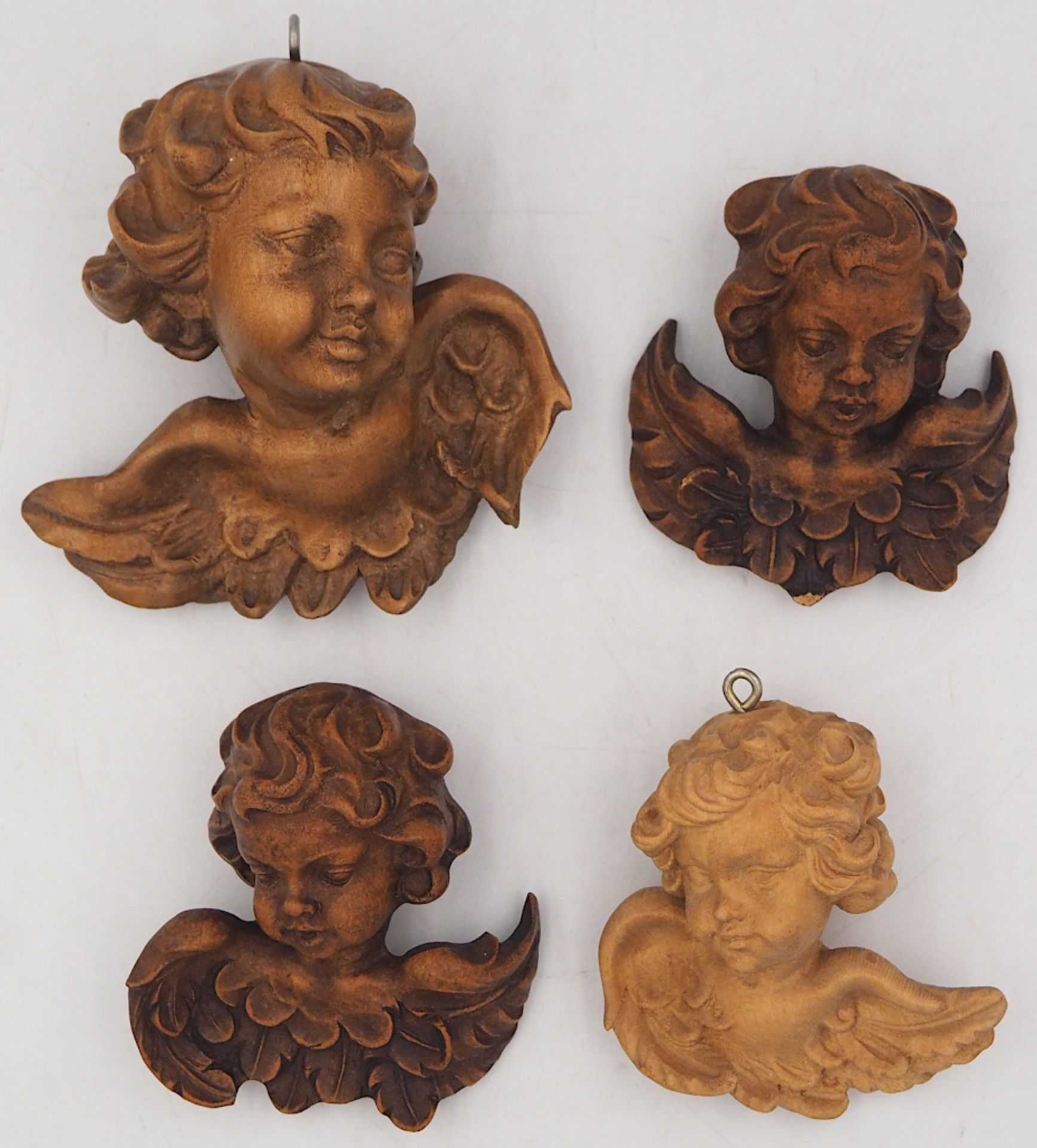 1 kleines Konv. Holzfiguren u.a., nztl. "Putti", bis H ca. 11cm, je Asp.