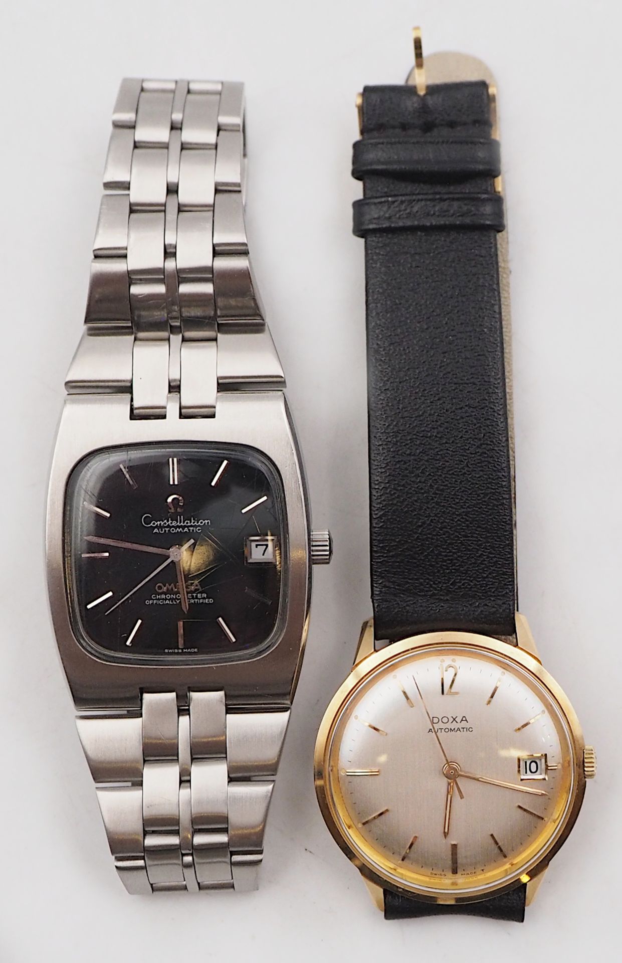 1 Armbanduhr OMEGA Constellation Automatic sowie 1 Armbanduhr DOXA Automatic wohl verg. Lederband er