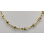 Kette mit Kugelelementen und Schmucksteinen, 750/18K Gelbgold, Italien, 24g, Länge 42cmNecklace with