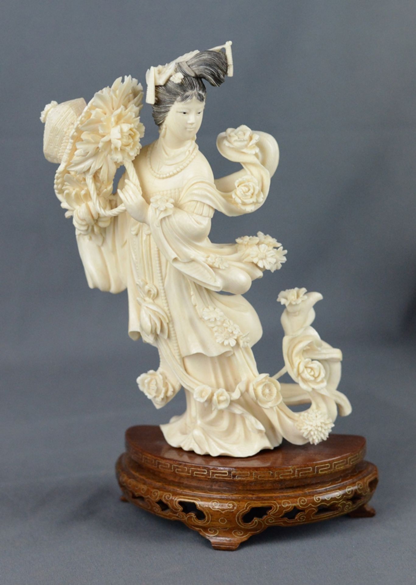 Guanyin figure, standing female figure, holding the a basket of peonies in her hands, richly decora - Image 2 of 5