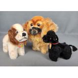 Steiff-Konvolut, bestehend aus drei Hunden: Snobby, Spaniel und Peky, alle mit Namensschild und Kno