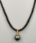Black diamond necklace with Tahitian pearl pendant in 585/14K yellow gold setting, magnetic clasp 5
