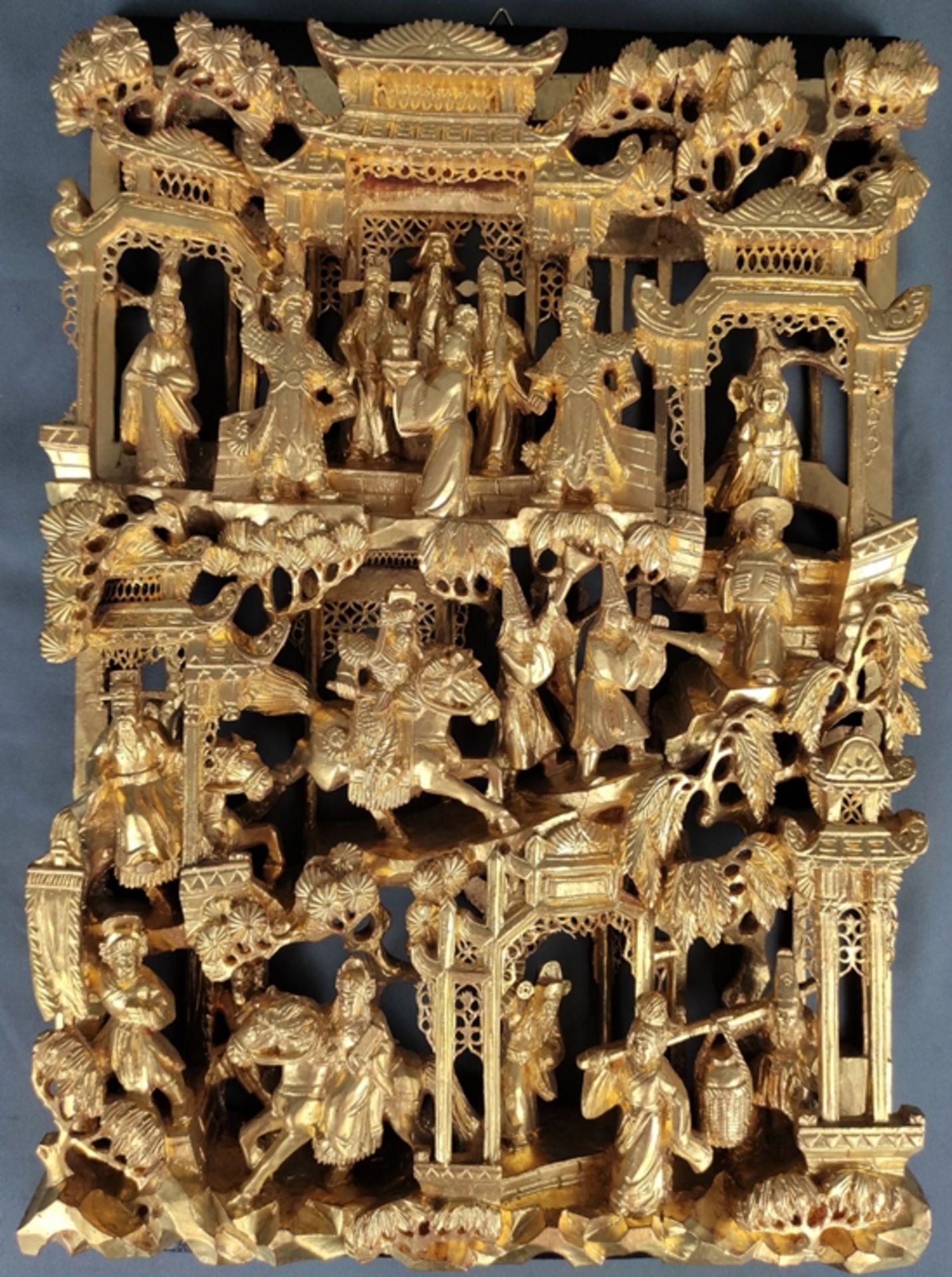 Chinese wall panel, elaborate carving with temple and parade scenes, gold plated wood, mid 20th cen