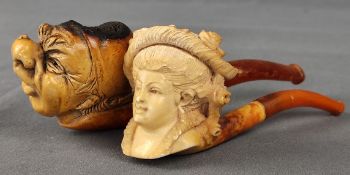 Zwei figürliche Meerschaumpfeifen, eine mit Kopf mit großer Nase und Mütze, Länge 12,5cm, die ander