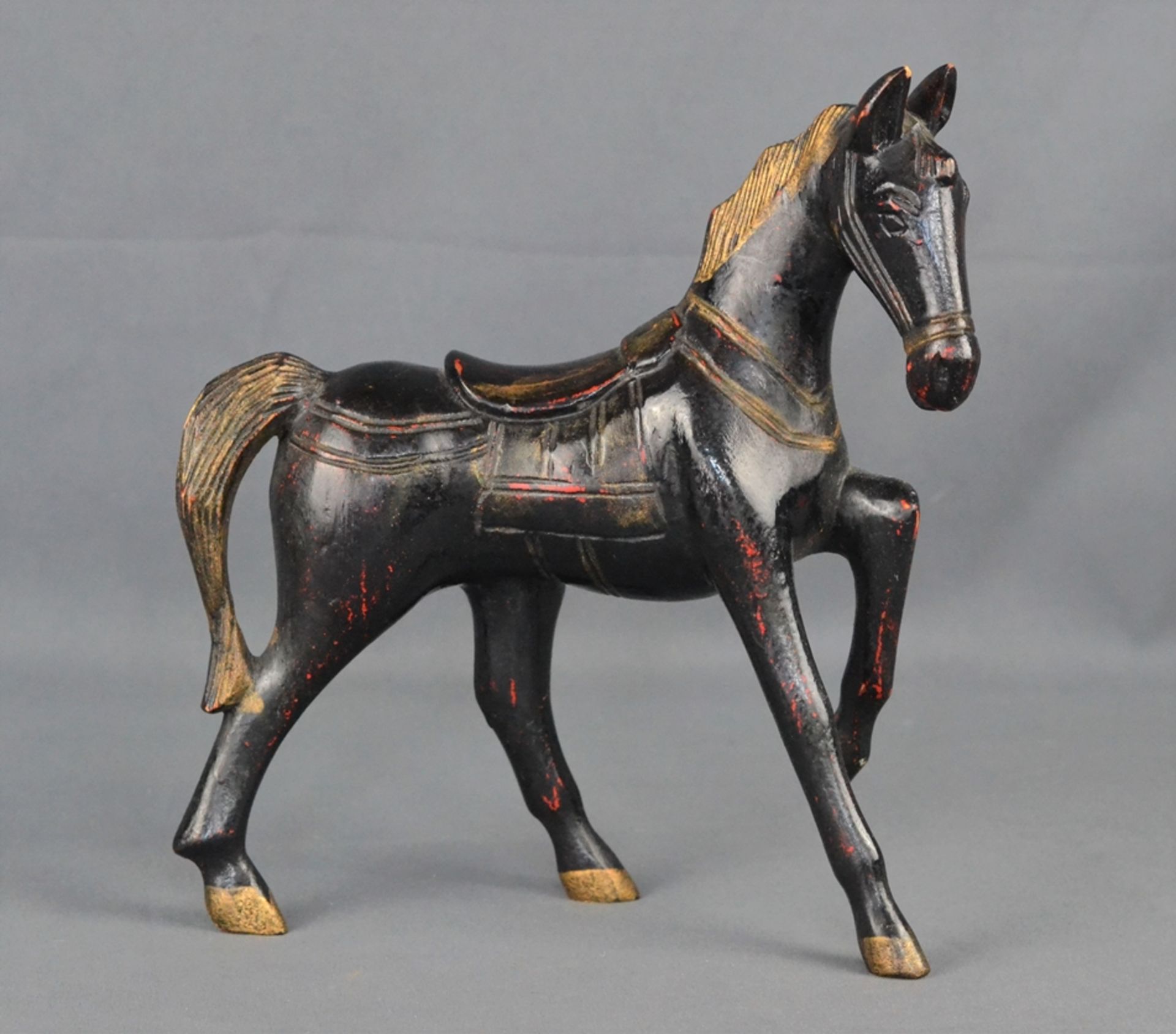 Decorative wooden horse, wood painted black, partially gilded, 20th century, 26x23x6cm