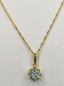 Pendant with light blue gemstone in diamond setting, yellow gold 585/14K, fine chain 585/14K with s