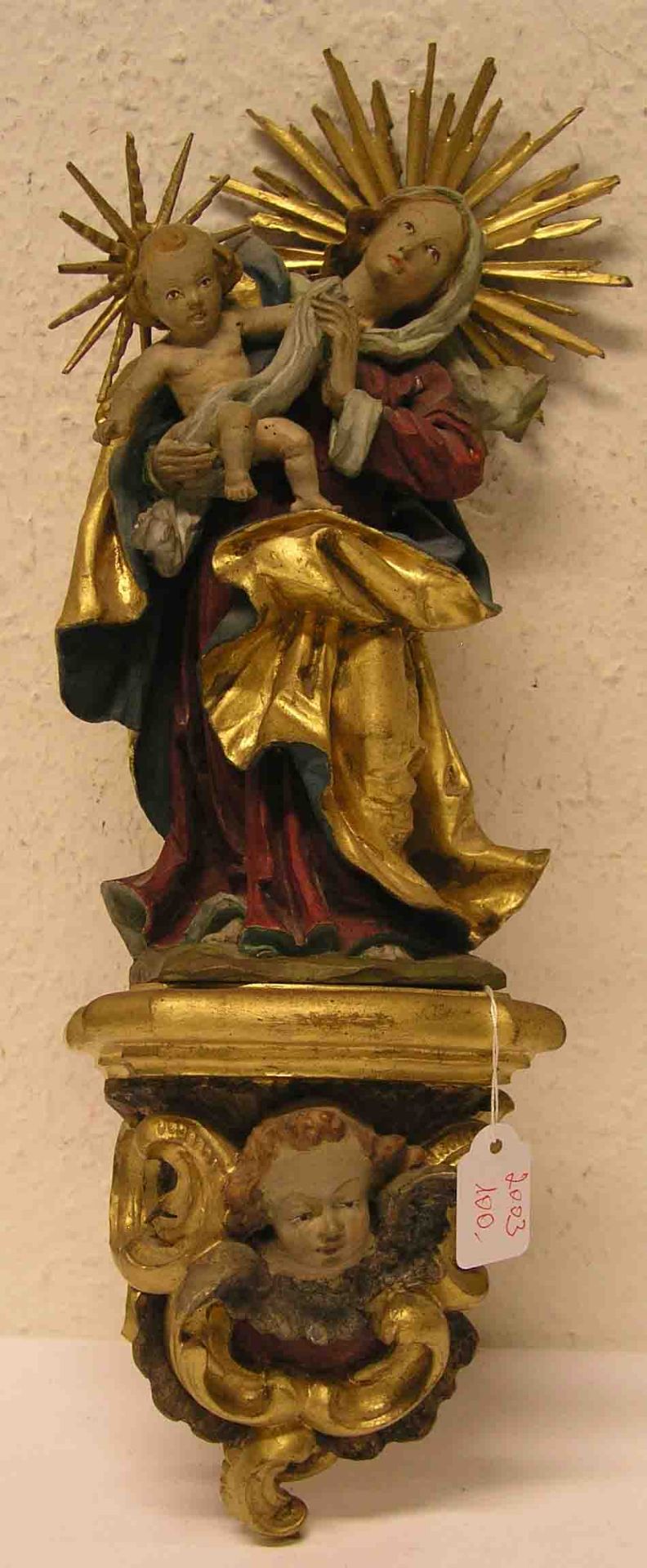 "Madonna mit Kind". Dazu dekorativer Sockel mit geflügeltem Engelskopf, Holz geschnitzt,farbig