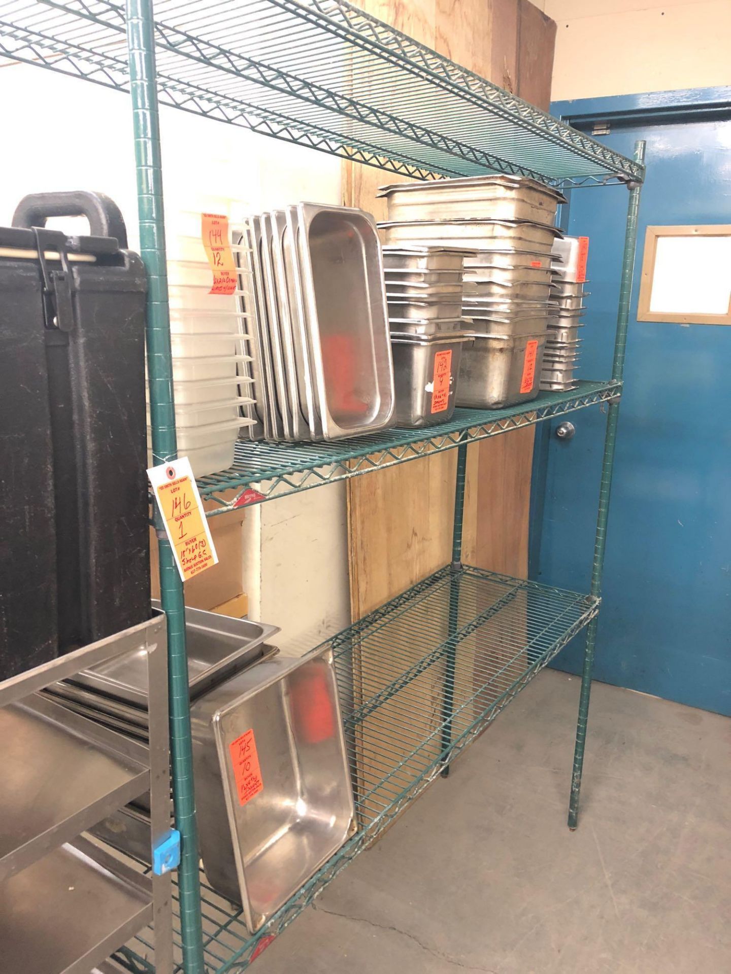 18” x 60” green epoxy coated shelving unit with three shelves