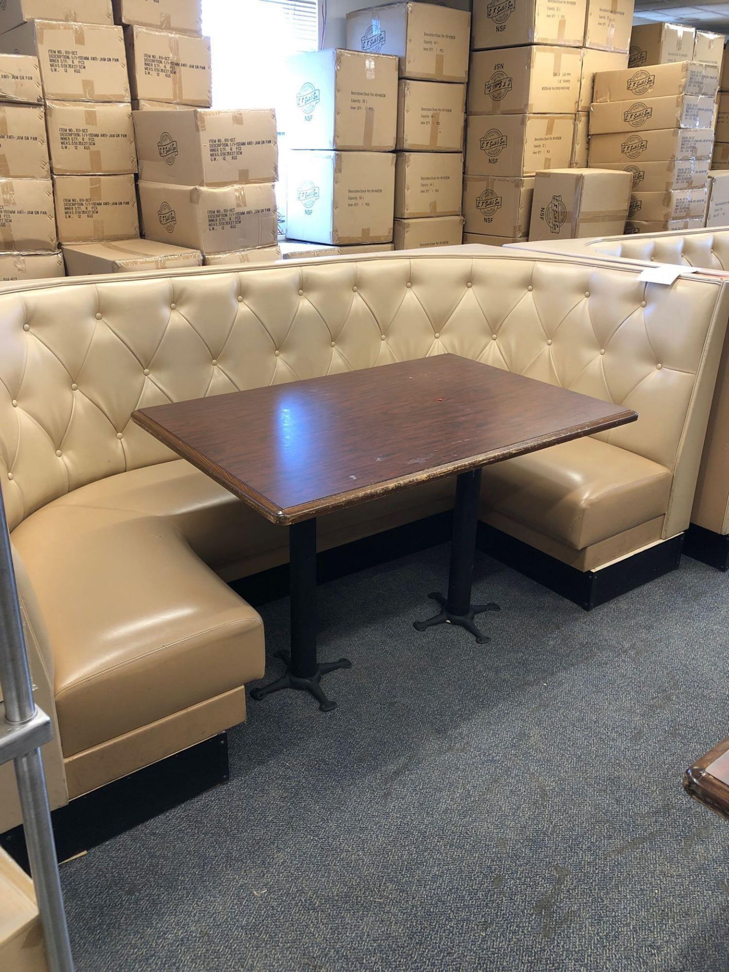 96” x 48” fully upholstered U-shaped booths with beige upholstery