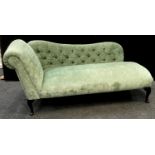 A modern chaise long, scrolling arm, button upholstered back. 80cm high x 176cm long x 64cm deep.