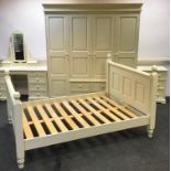 A modern painted pine bedroom suite comprising compactor wardrobe, dressing table, dressing