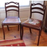 A pair of early Victorian mahogany side/dining chairs, swan crestings, one with bergere seat,