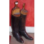 A pair leather riding boots and wooden stretcher