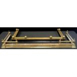 An Empire style brass fender spiraled corners, cast plates, 125cm wide; another (2)