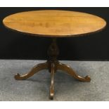 An oak circular pedestal table. 71.5cm high x 107cm diameter.