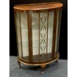 A 1940?s bow front display cabinet.