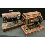 A vintage portable Singer hand operated sewing machine; another electronic with built-in light (2)