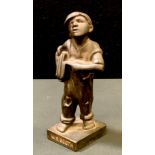 Advertising - a cast iron figure of a newspaper boy, stamped W.S. Booth (Iron Merchants in