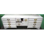 A 19th century white painted stationery cabinet, fitted with twelve drawers, 34.5cm high, 98cm wide,