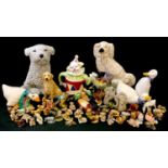 A stoneware model of a puppy, 23cm; a mantel dog; Wade Whimsies; a novelty clown teapot; a resin