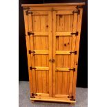 A modern pine wardrobe. 190cm high x 94cm wide x 62.5cm deep.