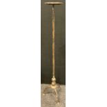 A tall, floor standing pricket candlestick, 101cm high