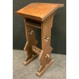 An early 20th century Gothic oak prayer/book stand, pierced sides, 76.5cm high, 35.5cm wide