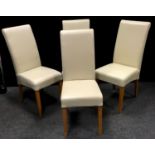 Four cream leather dining chairs