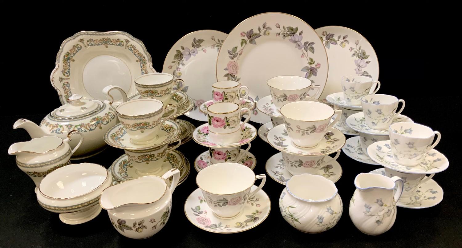 A Royal Worcester June Garland part tea set; a Royal Worcester Royal Garden pattern part coffee set;