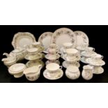 A Royal Worcester June Garland part tea set; a Royal Worcester Royal Garden pattern part coffee set;