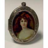 A silver portrait mounted oval locket, raven haired beauty, F Bros, Birmingham 1972, 32.3g