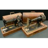 A vintage Singer hand operated portable sewing machine; another (2)