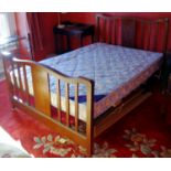 An early 20th century mahogany and boxwood strung double bed head and foot rest, 138cm wide, c.1910