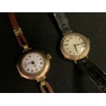 A 9ct gold lady's watch, 14 jewel movement, silver dial, Roman numerals, leather strap; another (2)