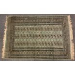 A Persian rug, central panel of three rows of medallions within multi layer border, light blue