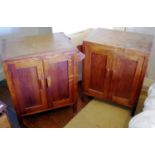 A pair of 20th century Heals limed oak bed side cabinets, two panelled doors, towel rail to one