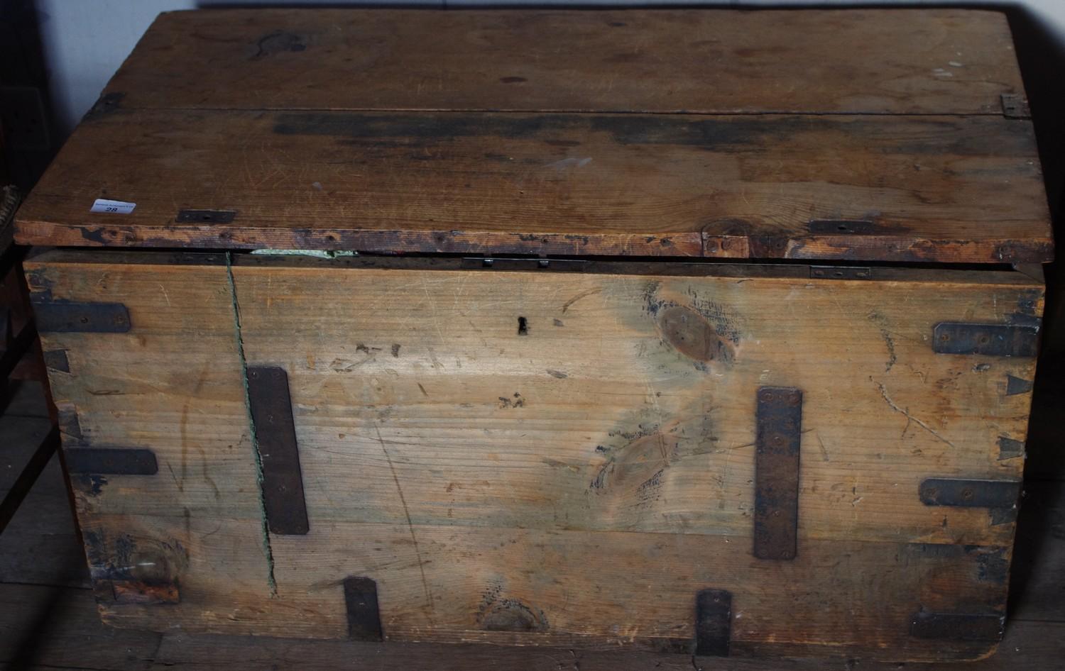 A late 19th century pine and metal bound travelling trunk, handles to sides, 49cm high, 92cm wide,